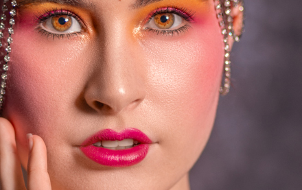 Woman in bright makeup dressed in 1920s theme